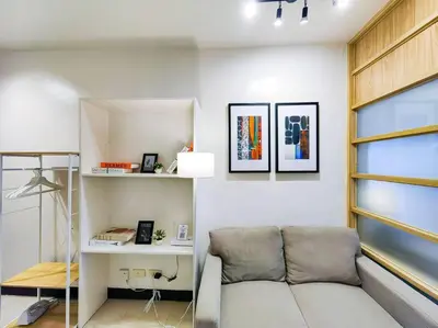 a living room with a couch and a desk at 1BR Condotel Ridgewood Towers Taguig City #RW09 in Manila