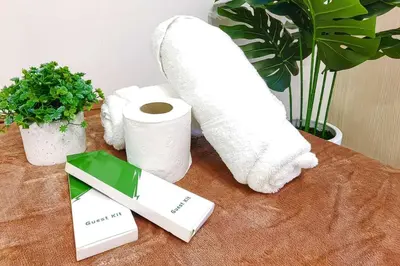 a table with toilet paper and a roll of paper at 1BR Condotel Ridgewood Towers Taguig City #RW11 in Manila