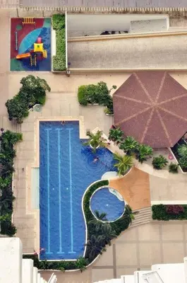 an overhead view of a swimming pool and an umbrella at 1BR Condotel Ridgewood Towers Taguig City #RW11 in Manila