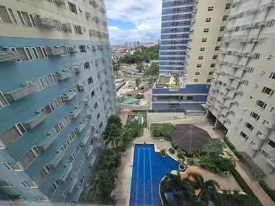 an aerial view of a pool between two buildings at 1BR Condotel Ridgewood Towers Taguig City #RW14 in Manila