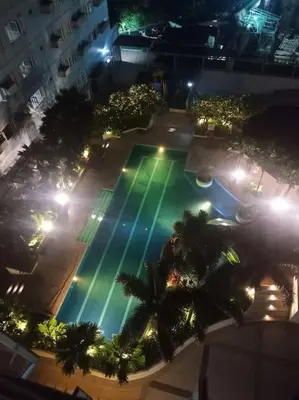 an overhead view of a swimming pool at night at 1BR Condotel Ridgewood Towers Taguig City #RW14 in Manila