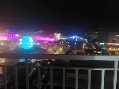 a view of a city at night with lights at Mall of Asia view from Balcony 15F in Manila
