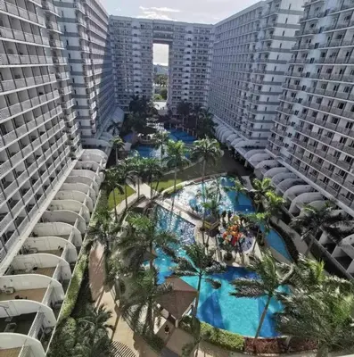 an aerial view of the pool at a resort at Mall of Asia view from Balcony 15F in Manila