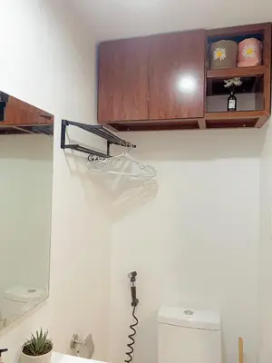 a bathroom with a sink and a toilet in a room at Beans Crib Staycation at SMDC Green 2 Residences in Dasmariñas