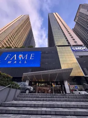 a set of stairs in front of two tall buildings at Fame Residences EDSA Shaw MRT Shangrila Megamall in Manila