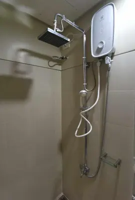 a shower in a bathroom with a shower head at S Residences in Manila