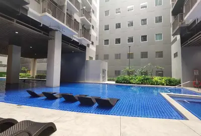a swimming pool in the middle of a building at S Residences in Manila