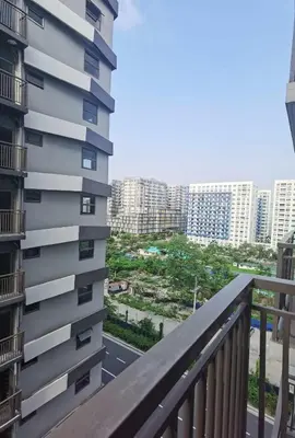 a balcony with a view of a city at S Residences in Manila