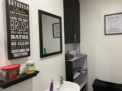 a bathroom with a sink and a mirror on the wall at Condo In Manila in Manila