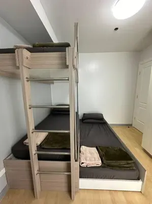 a room with two bunk beds in a room at Spacious 2-bedroom Corner Unit across Shangri-La in Manila