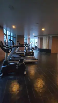 a gym with several exercise bikes in a room at Eastwood LeGrand 3 Eastwood City, Quezon City in Manila