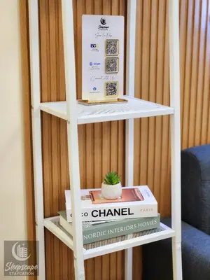 a book shelf with a cactus on top of it at SleepScape Staycation in Manila