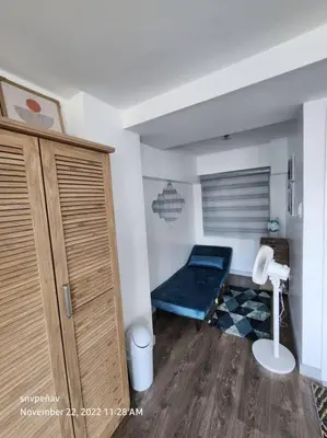 a room with a bed in the corner of a room at Fort Victoria Tower B Condo BGC, Taguig City in Manila