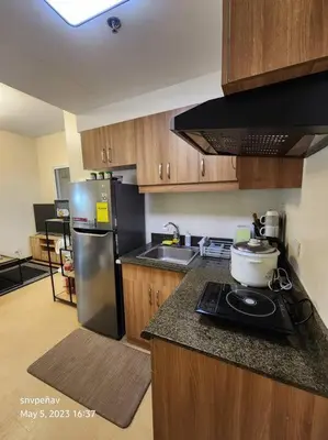 a kitchen with a stove and a refrigerator at Torre de Manila Unit 1720 Taft Avenue Manila Unit 1720 in Manila
