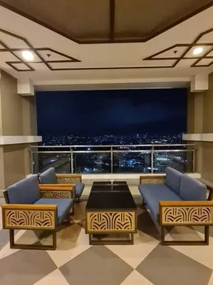 a room with a view of a city at night at Torre de Manila Unit 1720 Taft Avenue Manila Unit 1720 in Manila