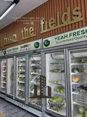 a grocery store aisle with refrigerators and food at Infinite Space at Acqua Private Residences - Iguazu Tower in Manila
