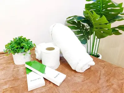 a table with two rolls of paper towels and plants at 1BR Condotel with Balcony at SM Light Residences #LT02 in Manila