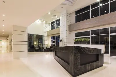 a lobby of a building with a reception desk at 1BR Condotel with Balcony at SM Light Residences #LT04 in Manila