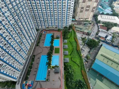 an overhead view of a large building with swimming pools at 1BR Condotel with Balcony at SM Light Residences #LT04 in Manila
