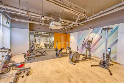 a gym with treadmills and exercise bikes at The Connor Serviced Residences Managed by HII in Manila