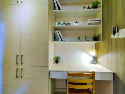 a desk with a chair in a room with shelves at 1BR Condotel with Balcony at FAME Residences #FM02 in Manila