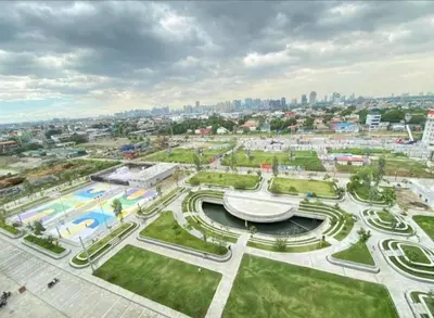 an aerial view of a park with a city in the background at Deca Suites 946 in Manila
