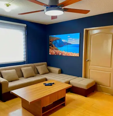 a living room with a couch and a coffee table at 2BR Italian-inspired Condo Unit, Balcony Pool View in Manila