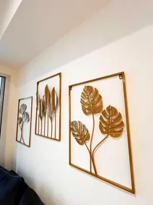three framed pictures of plants on a wall at Hope Stays in Manila