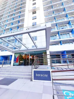 a building with a bergagency sign in front of it at Hope Stays in Manila