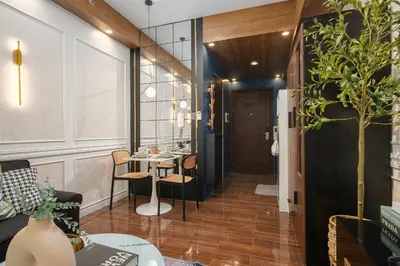 a room with a table and chairs and a door at Air Residences, SMDC, Makati in Manila
