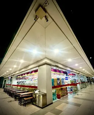 a store front of a store with benches and tables at Humpreys Comforts in Manila