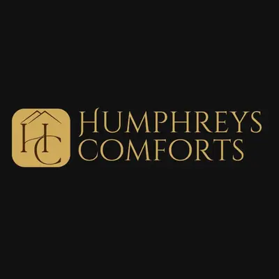 a gold logo with the wordsinators computers at Humpreys Comforts in Manila