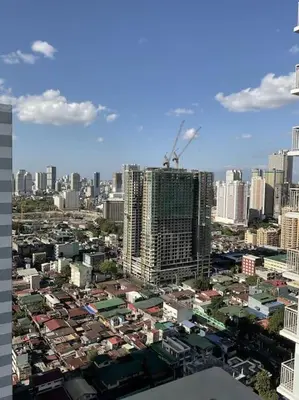 a city with tall buildings in a city at Sky PortLuxe Studio Near MOA in Manila