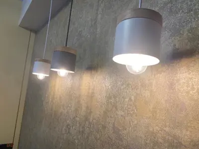 a group of lights hanging from a wall at Penthouse Fantasy in Manila