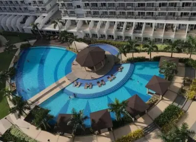 an overhead view of a large swimming pool in a resort at Shell Residences Staycation near SM MOA in Manila