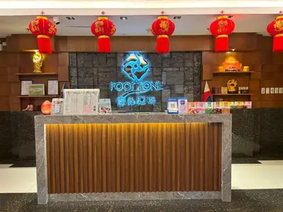 a restaurant with a rock one counter with red lights at Lido De Paris Hotel in Manila