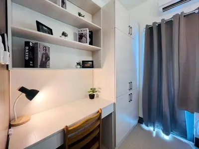 a home office with a desk and a window at 1BR Condotel with Balcony at FAME Residences #FM12 in Manila