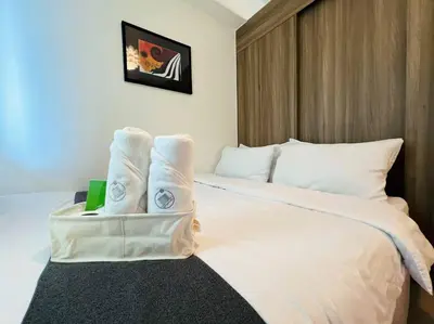 a hotel room with a bed with towels on it at 1BR Condotel with Balcony at FAME Residences #FM12 in Manila