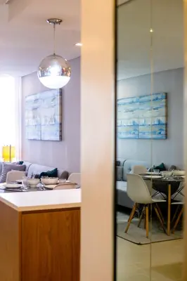a waiting room with a table and chairs at Antel Spa & Serenity Suites in Manila