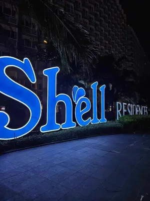 a lit up sign for a hotel at night at 1 Bedroom Condo Unit Near MOA with Netflix and WIFI in Manila