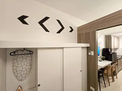a kitchen and dining room with a white counter top at 1BR Condotel with Balcony at FAME Residences #FM40 in Manila