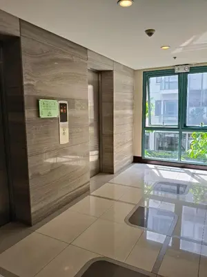 a lobby with a glass floor in a building at LDN Secret Crib - Two Palm Tree Newport City in Manila