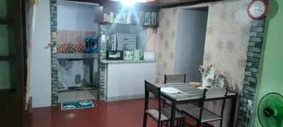 a dining room with a table and chairs in a room at 3J's Place in General Trias