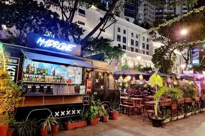 a food truck parked in front of a restaurant at BGC Staycation: 1BR Condo Uptown Area #ournw12d in Manila