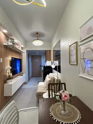 a living room with a couch and a table at The 3rd Staycation Near MOA, Airport, with FREE WIFI, Netflix in Manila