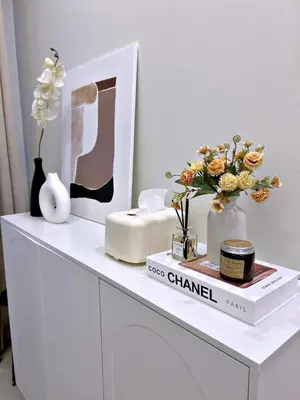 a white table with vases and flowers on it at The 3rd Staycation Near MOA, Airport, with FREE WIFI, Netflix in Manila