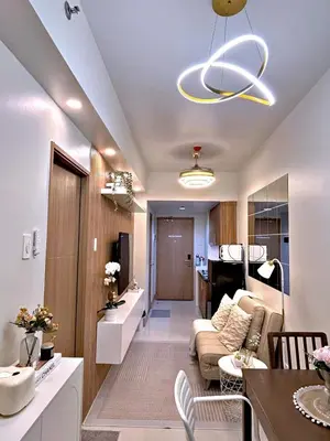 a living room with a couch and a table at The 3rd Staycation Near MOA, Airport, with FREE WIFI, Netflix in Manila