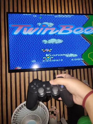 a person playing a video game on the nintendo wii at Condotel Near NAIA - massage chair footspa, dance revo, small pet allowed in Manila
