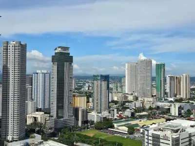 a view of a city with tall buildings at 1BR Condotel with Balcony at FAME Residences #FM46 in Manila
