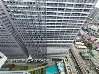 an overhead view of a tall building in a city at 1BR Condotel with Balcony at FAME Residences #FM49 in Manila